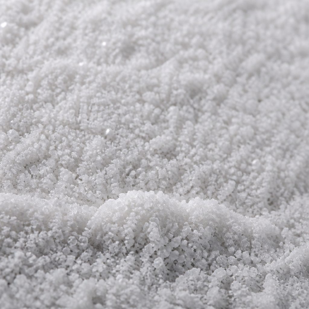 Fine densely packed white L-carnosine crystals, macro texture