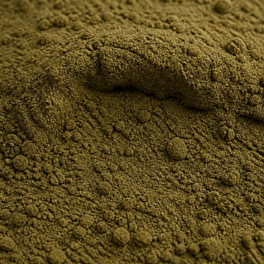 Fine olive-brown oolong tea powder with a greenish cast, macro texture